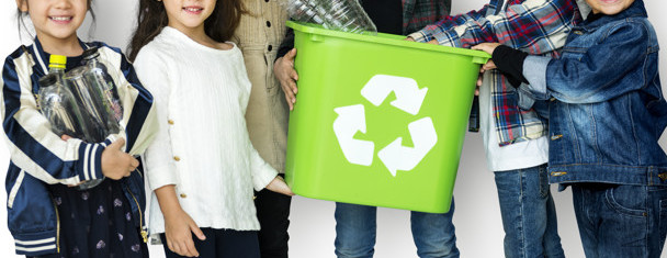 A group of young children recycling
